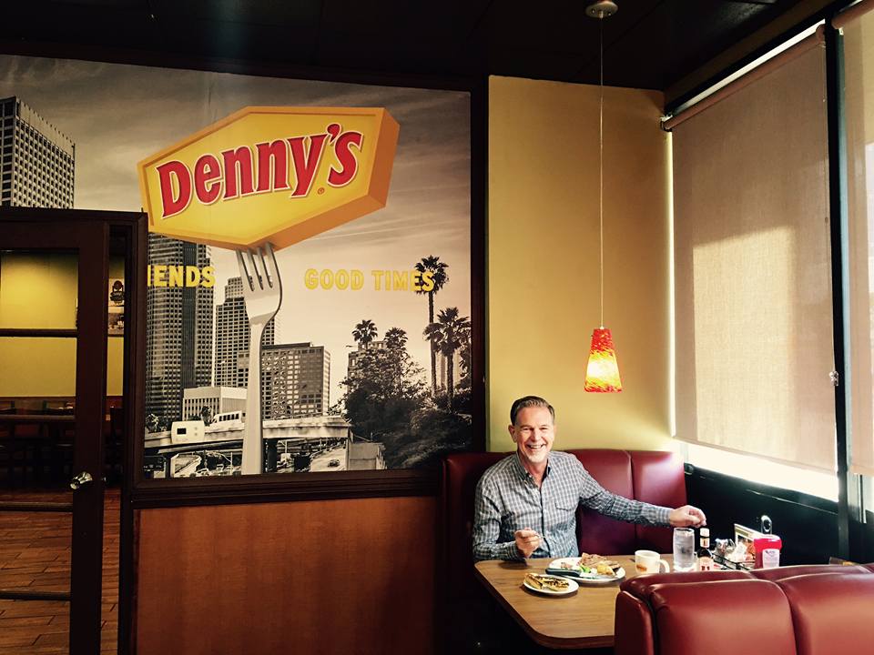 CEO Reed Hastings celebrating an earlier milestone at Denny's.