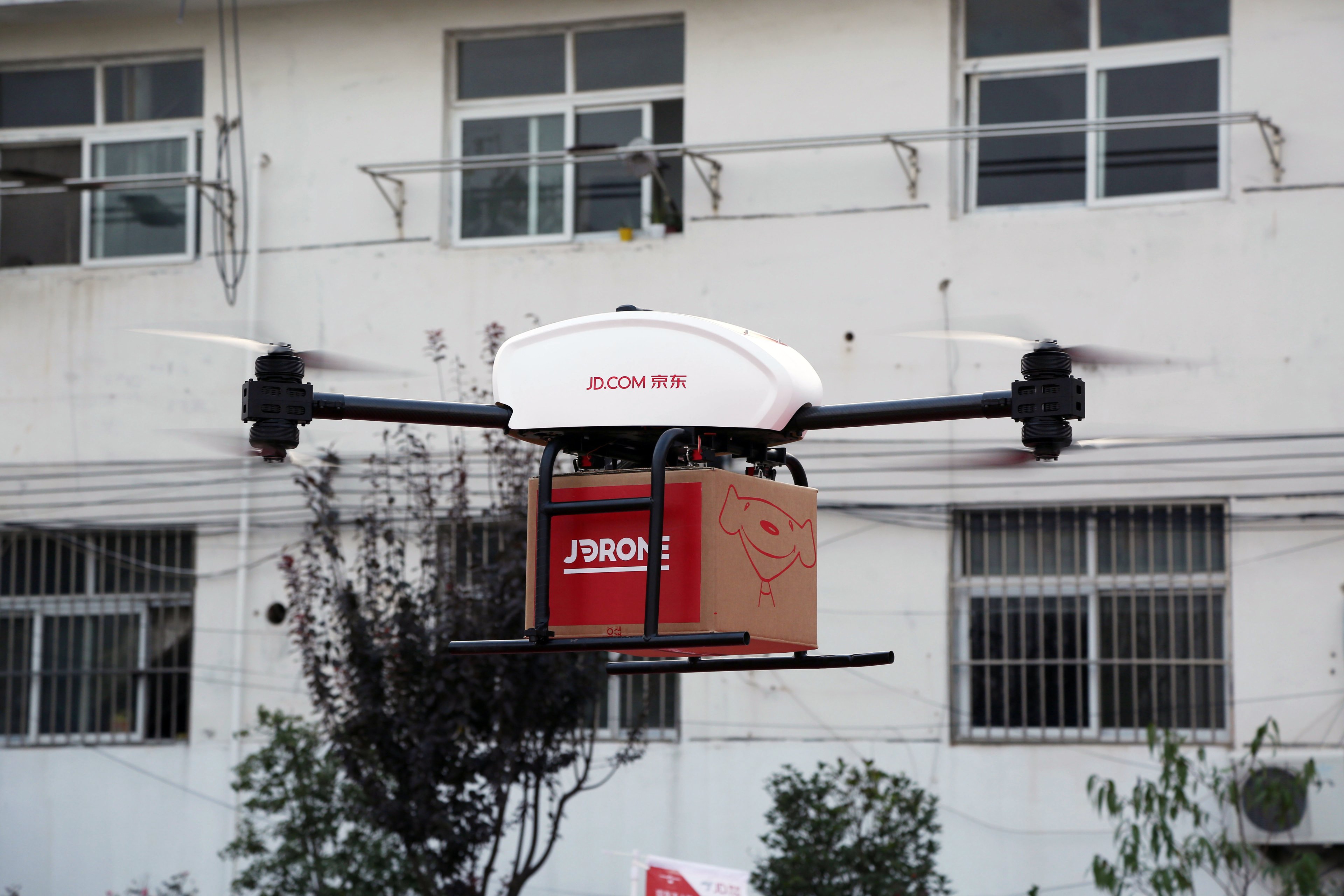 A drone carrying a package from JD.com