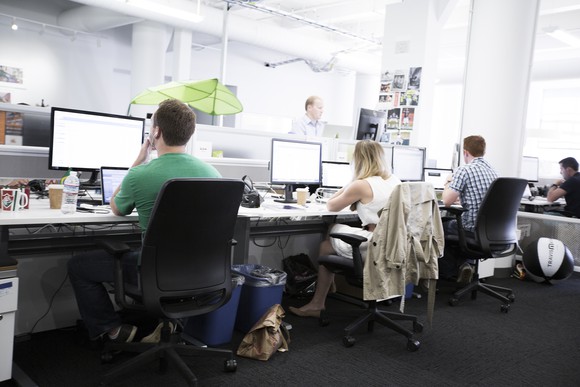 Zendesk employees working at their computers at the company's headquarters