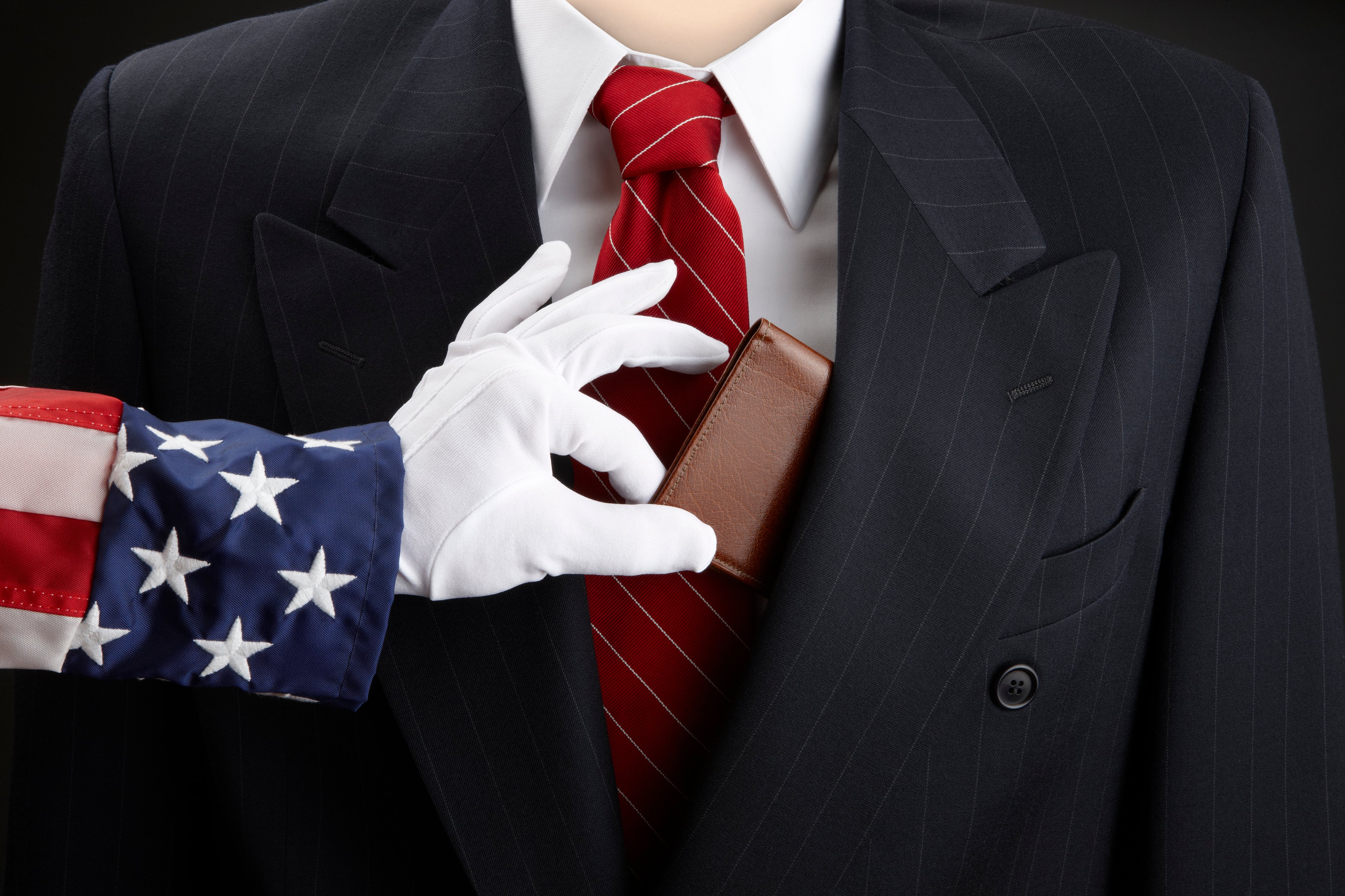 Uncle Sam grabbing a wallet from a businessman.