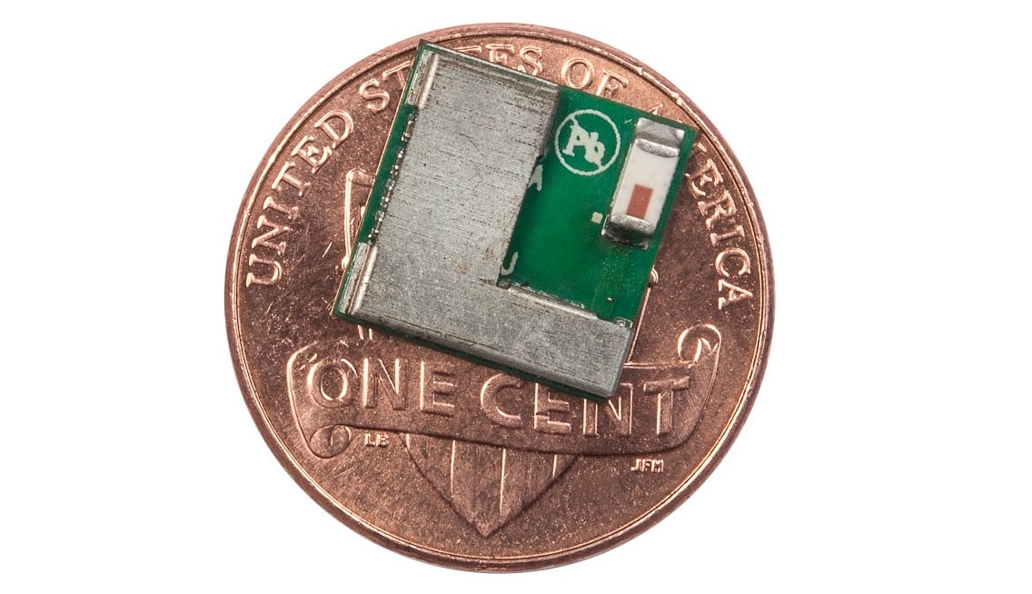 A Cypress Semiconductor Bluetooth chip sitting on a penny