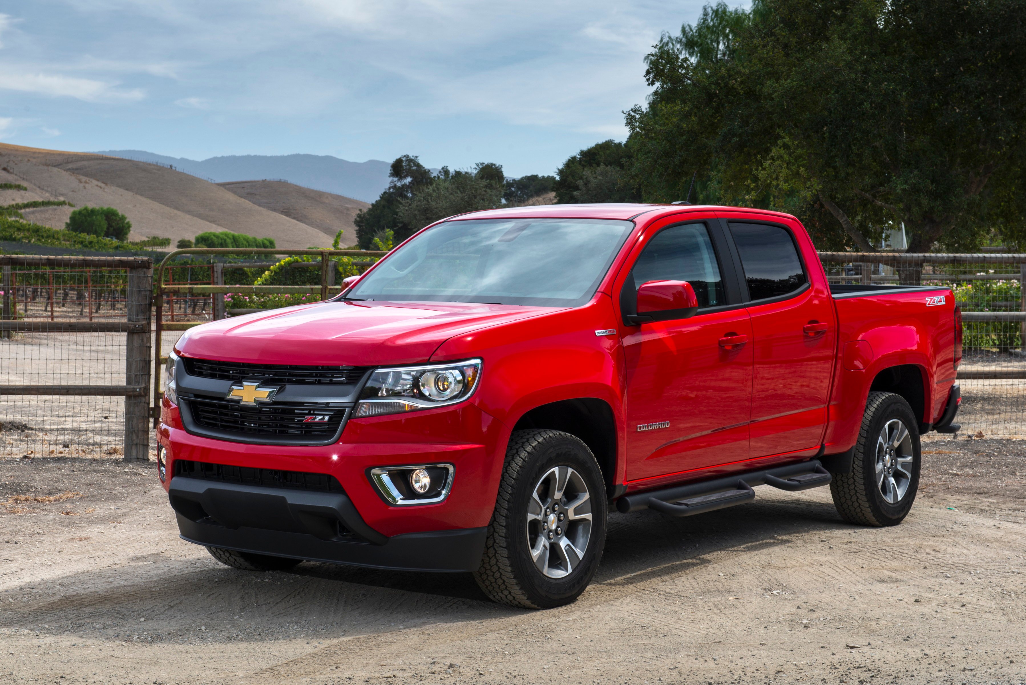 A red 2018 Chevrolet Colorado midsize pickup truck.