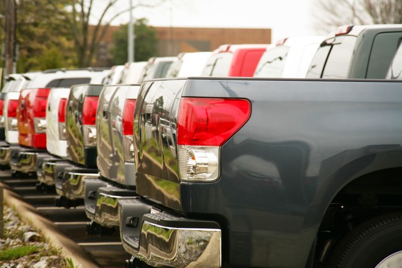 Row of trucks at a dealership lot