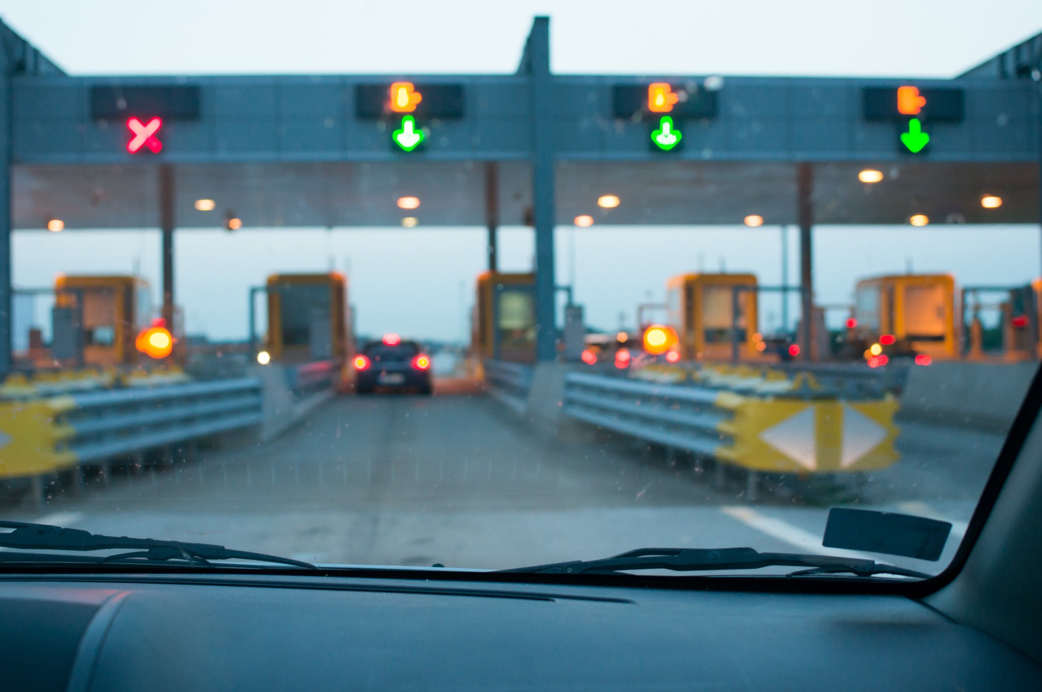 a driver arriving at a toll road booth