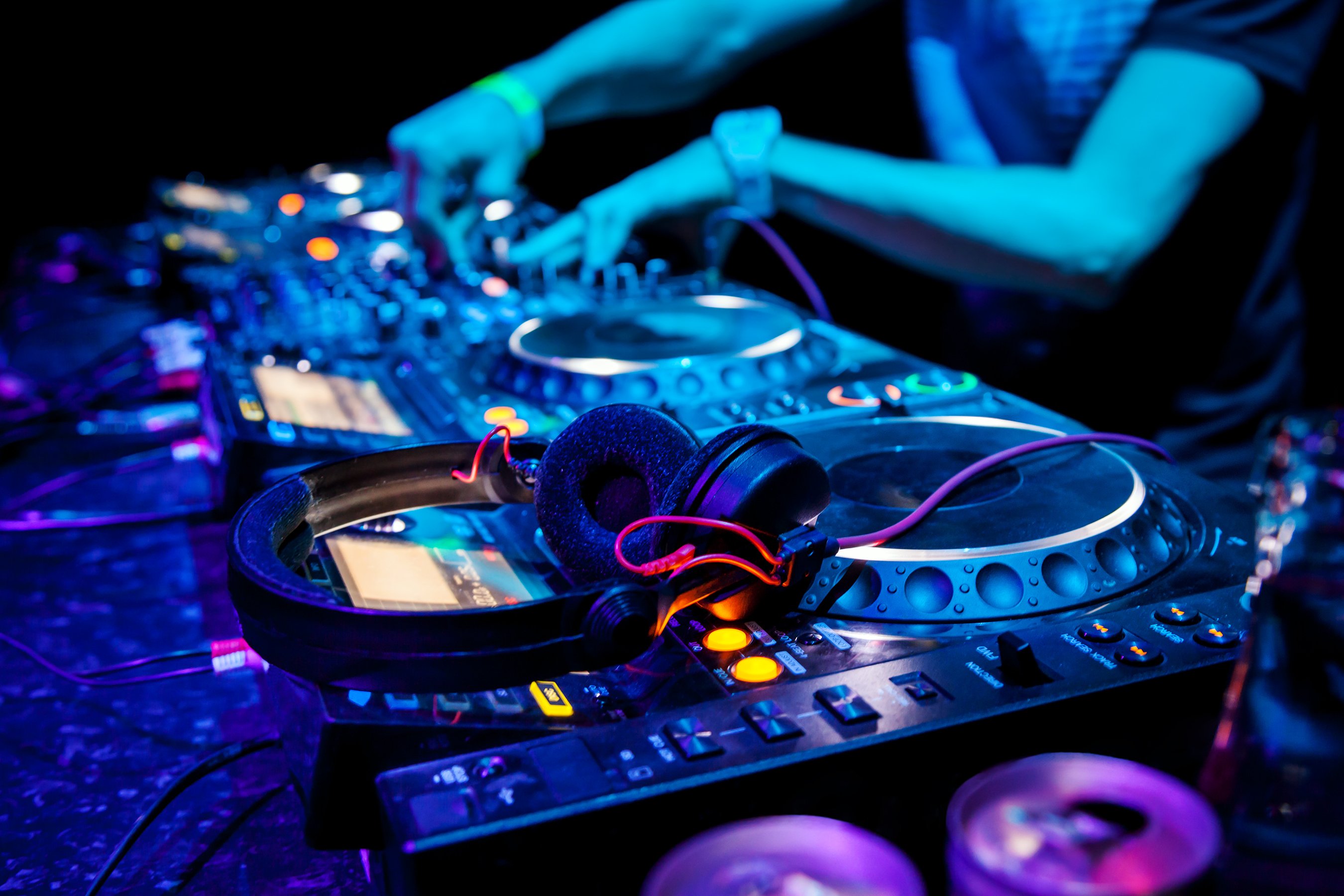 A DJ plays a dance track.