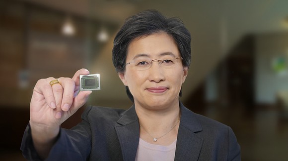 AMD CEO Lisa Su holding a chip.