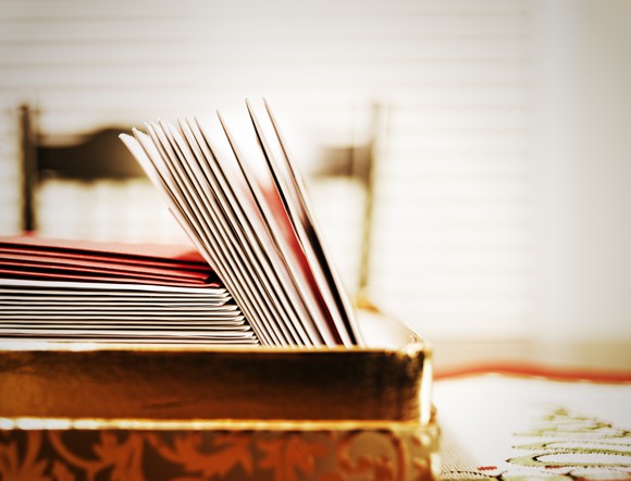 Cards in a box on a tabletop.