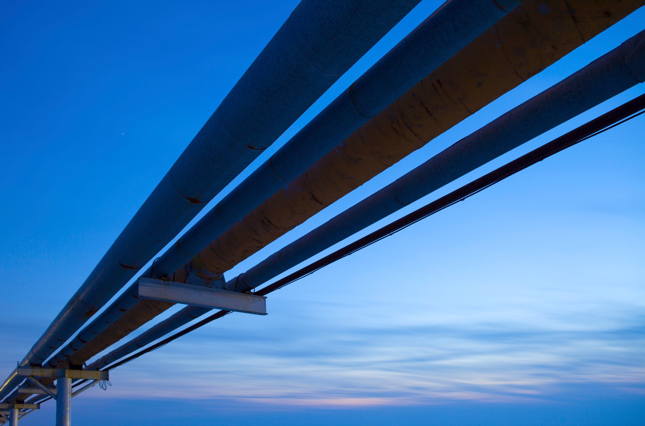 Pipelines with a blue sky in the background.
