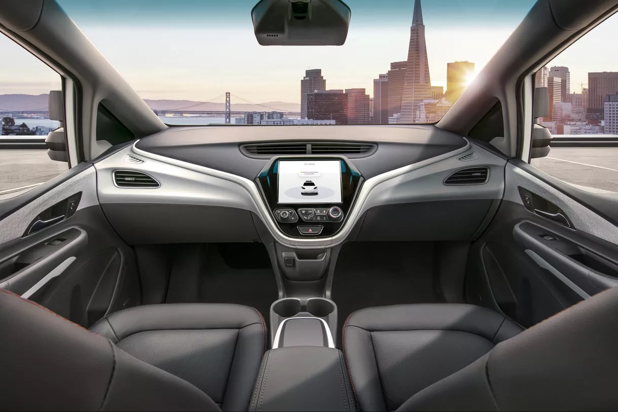 Interior view of GM's driverless car, overlooking a city landscape.