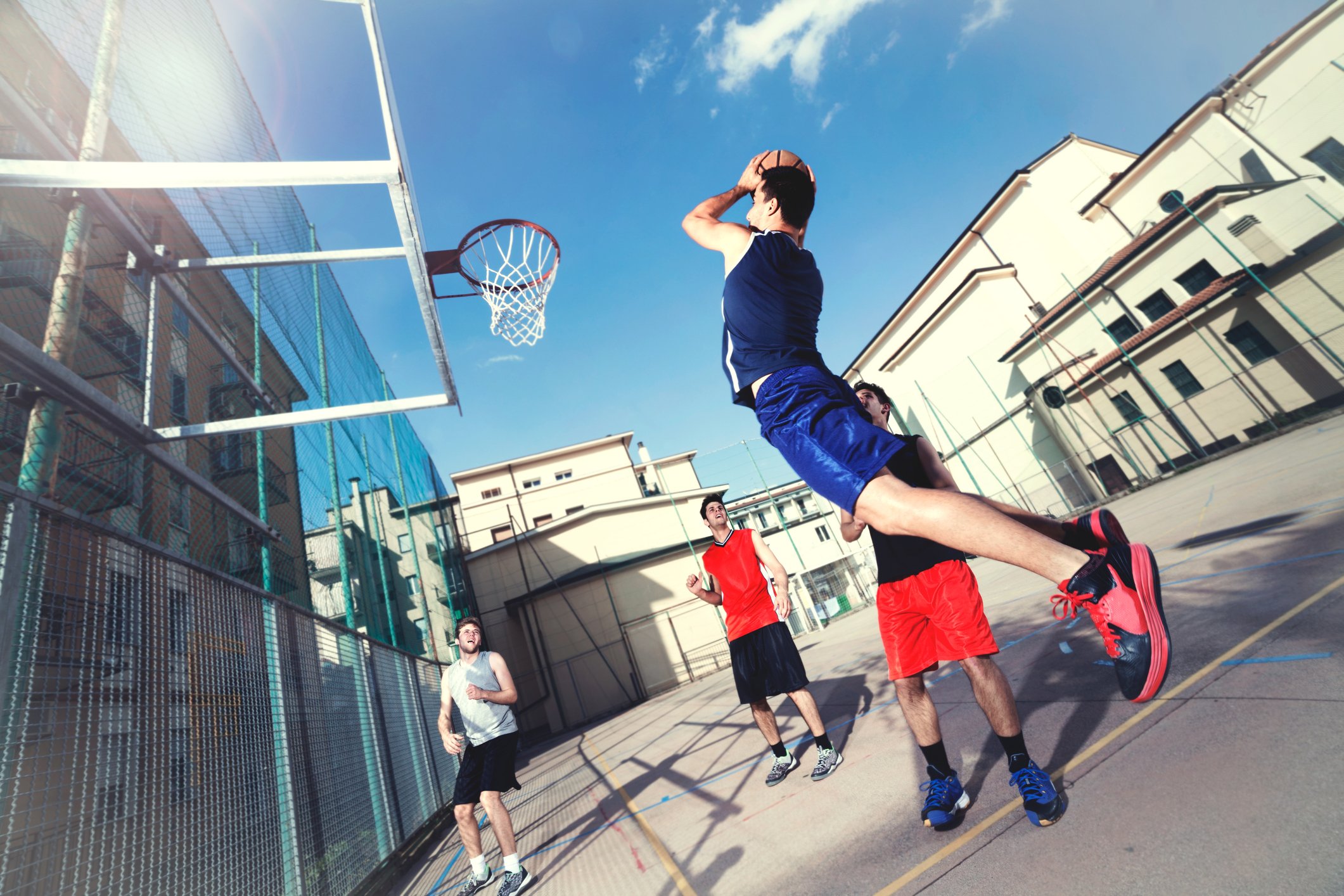 A game of outdoor pickup basketball.