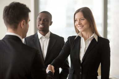 professionals shaking hands_GettyImages-695760038