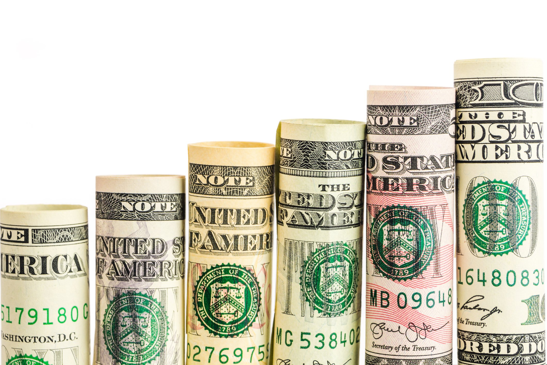 Rolls of various denominations of US banknotes.