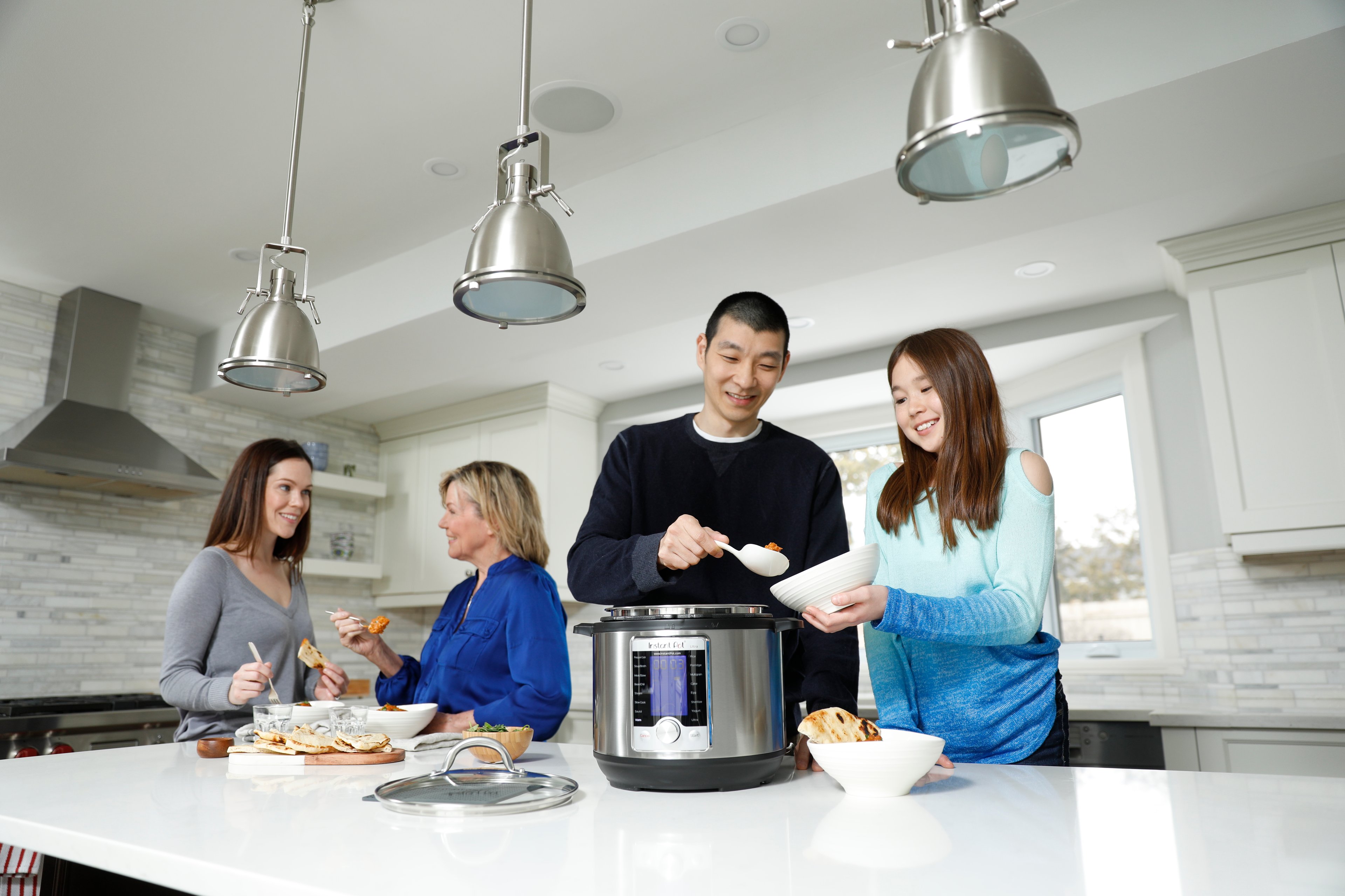 Family serving meal out of an Instant Pot