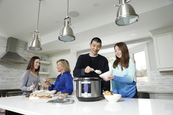 Family serving meal out of an Instant Pot