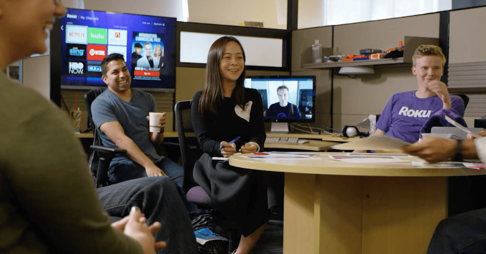 Roku employees sitting around a table