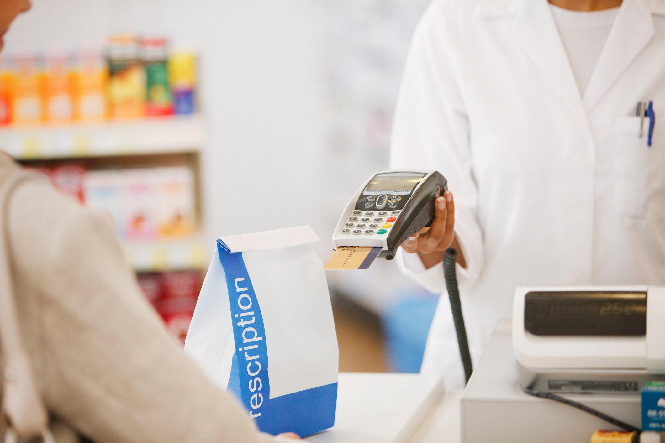 Customer checking out at pharmacy counter
