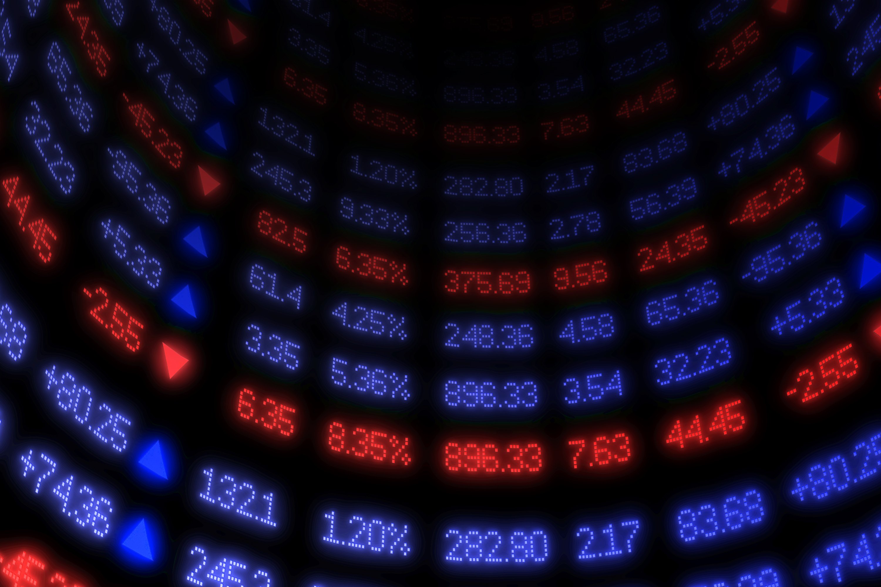 Curved wall with stock quotes, up in blue, down in red.