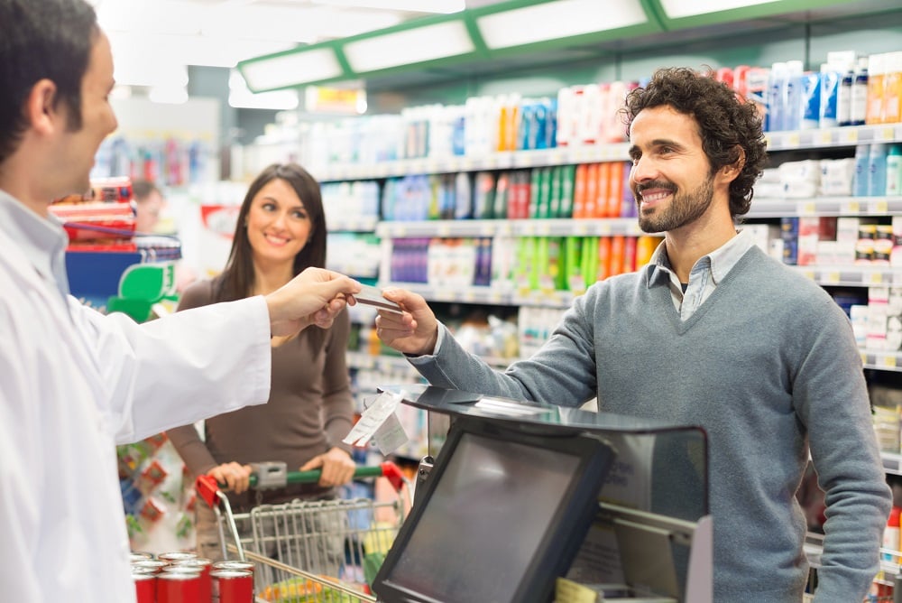 Customer paying at a pharmacy.
