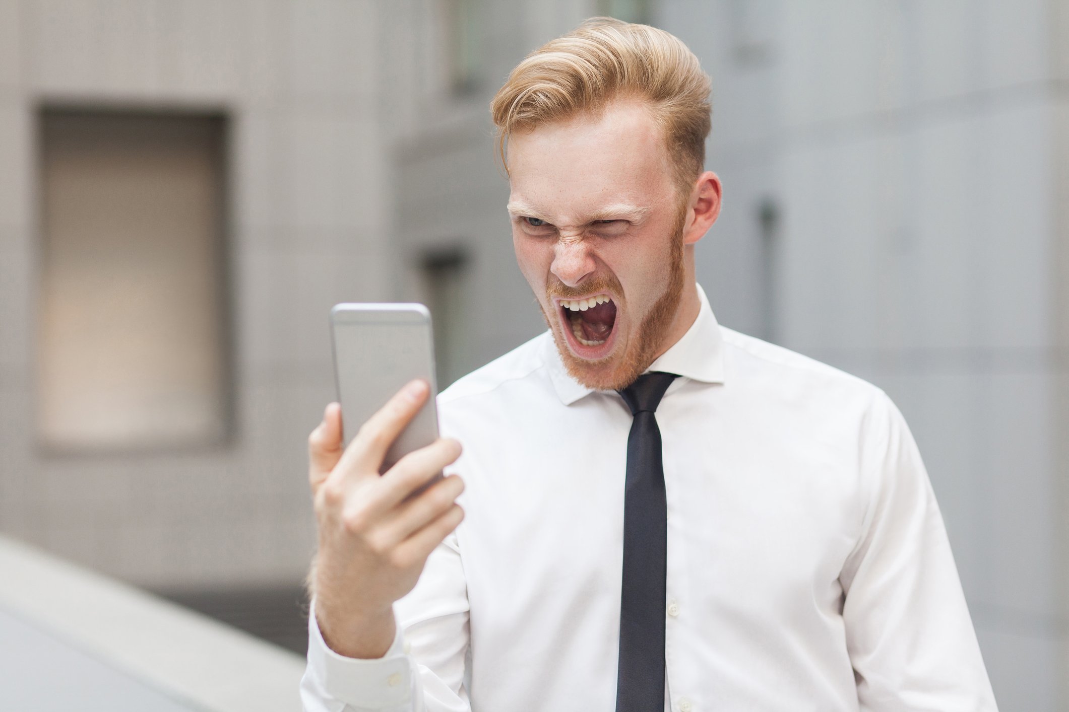 Man yelling at cellphone