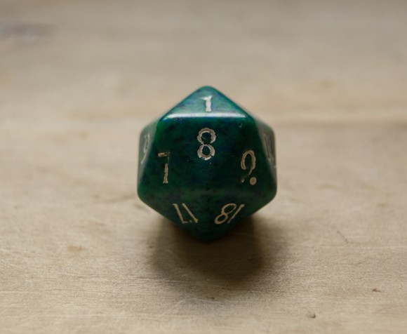 Green twenty sided dice.