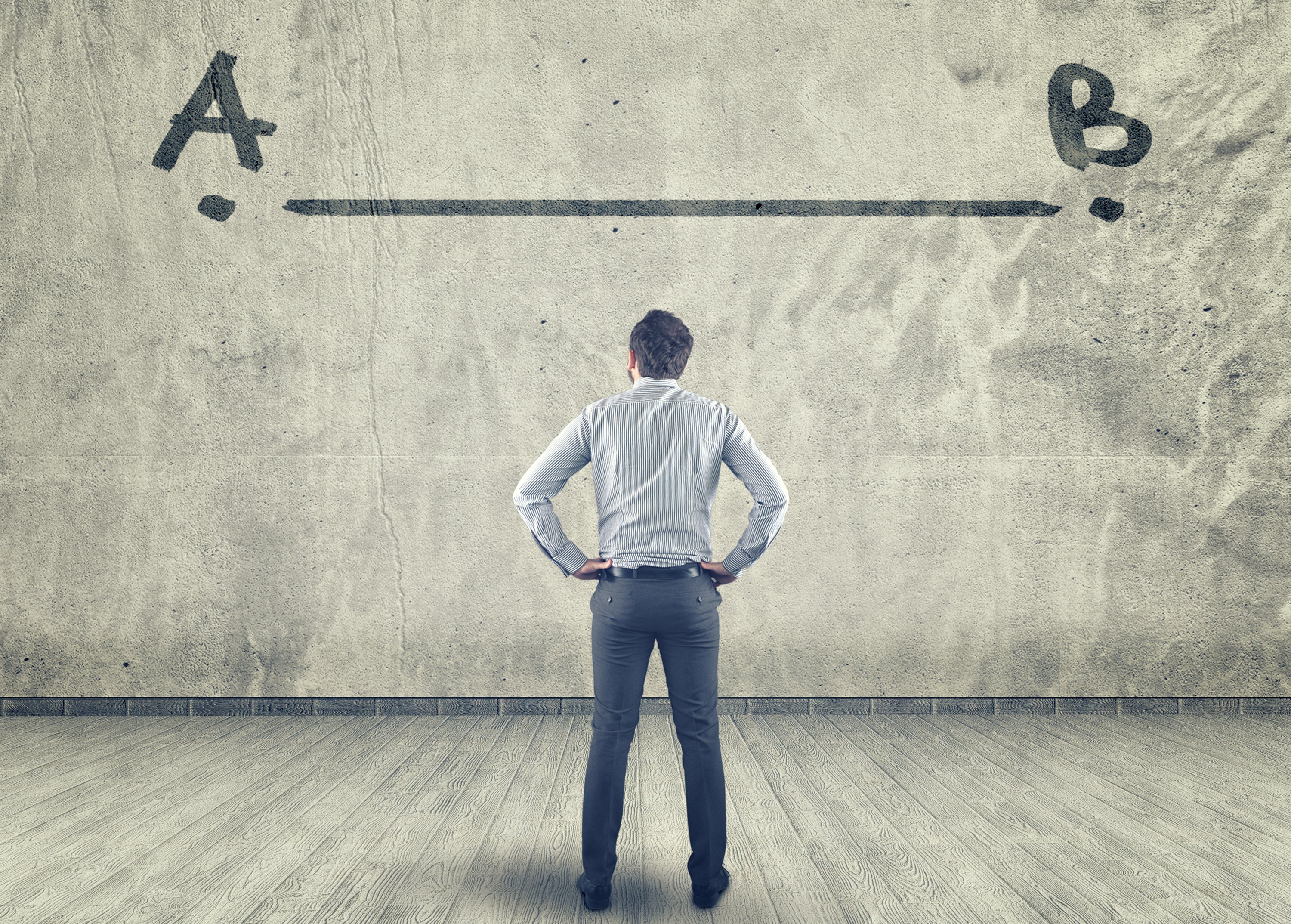 Man facing wall with line and points A and B drawn on wall