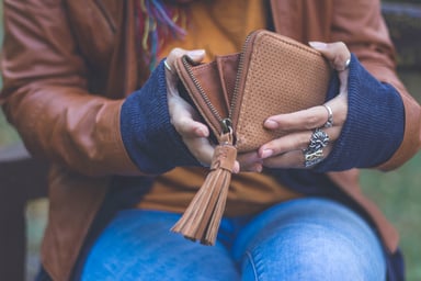 GettyImages-woman with empty wallet