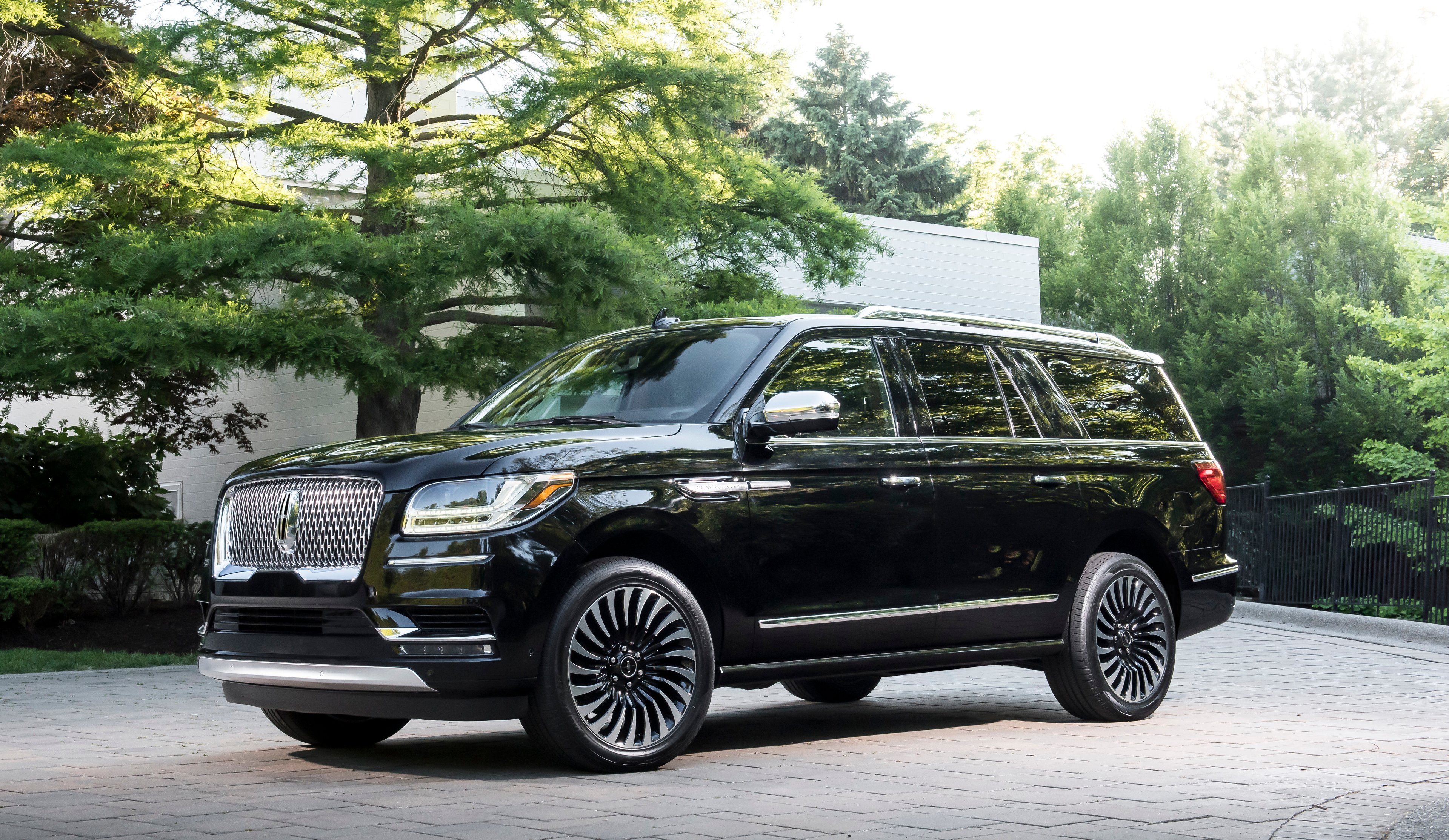 A black 2018 Lincoln Navigator Black Label, a large luxury SUV.