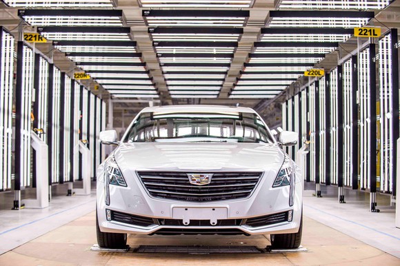 A white Cadillac CT6 luxury sedan in the final inspection area of GM's Shanghai factory.