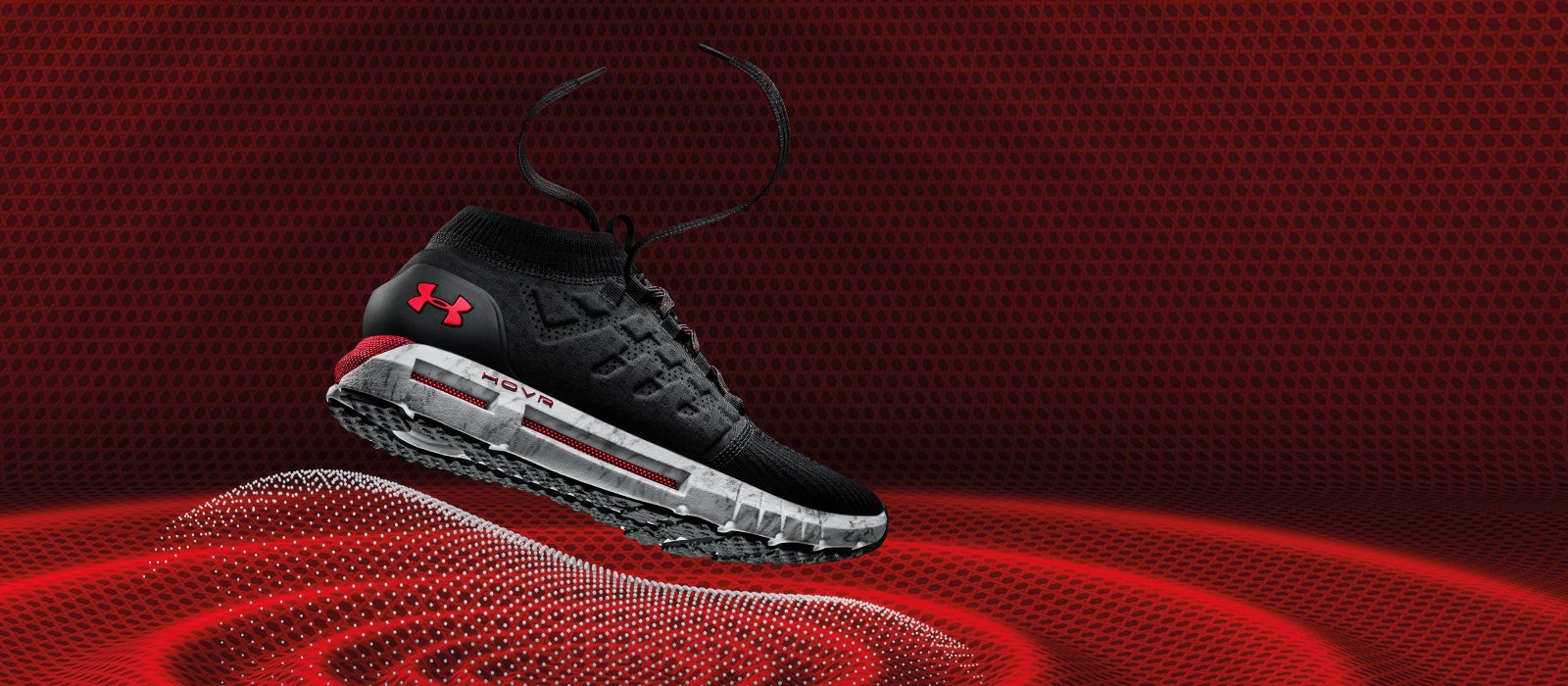 Under Armour's Hovr running shoe against a red background