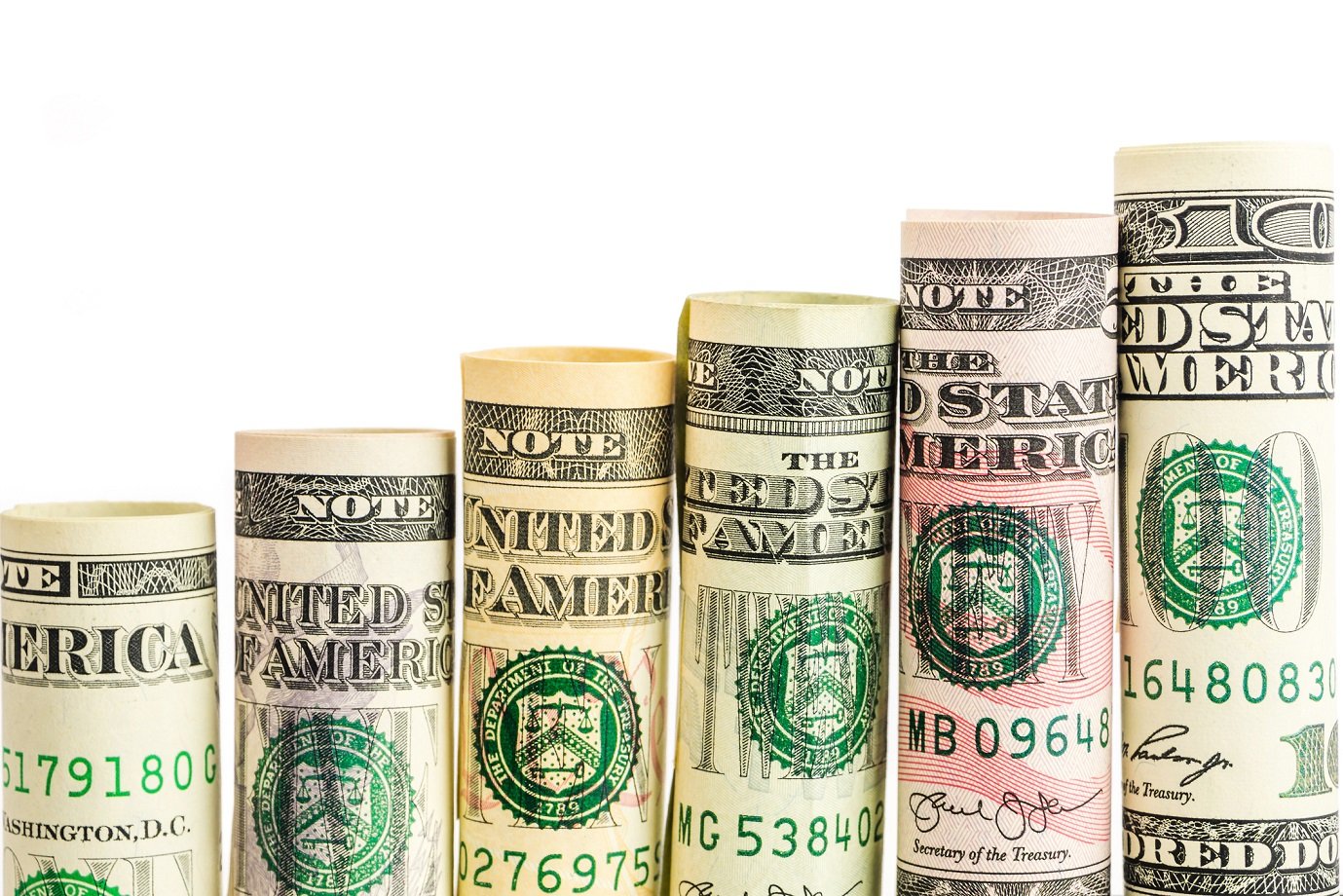 Six rolls of increasing denominations of U.S. currency.