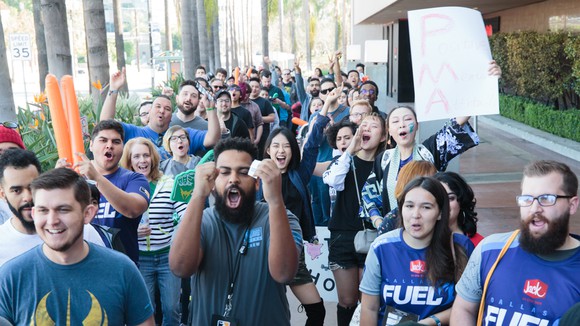 Excited fans waiting in line to watch Overwatch League matches.