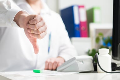 Doctor with thumbs down