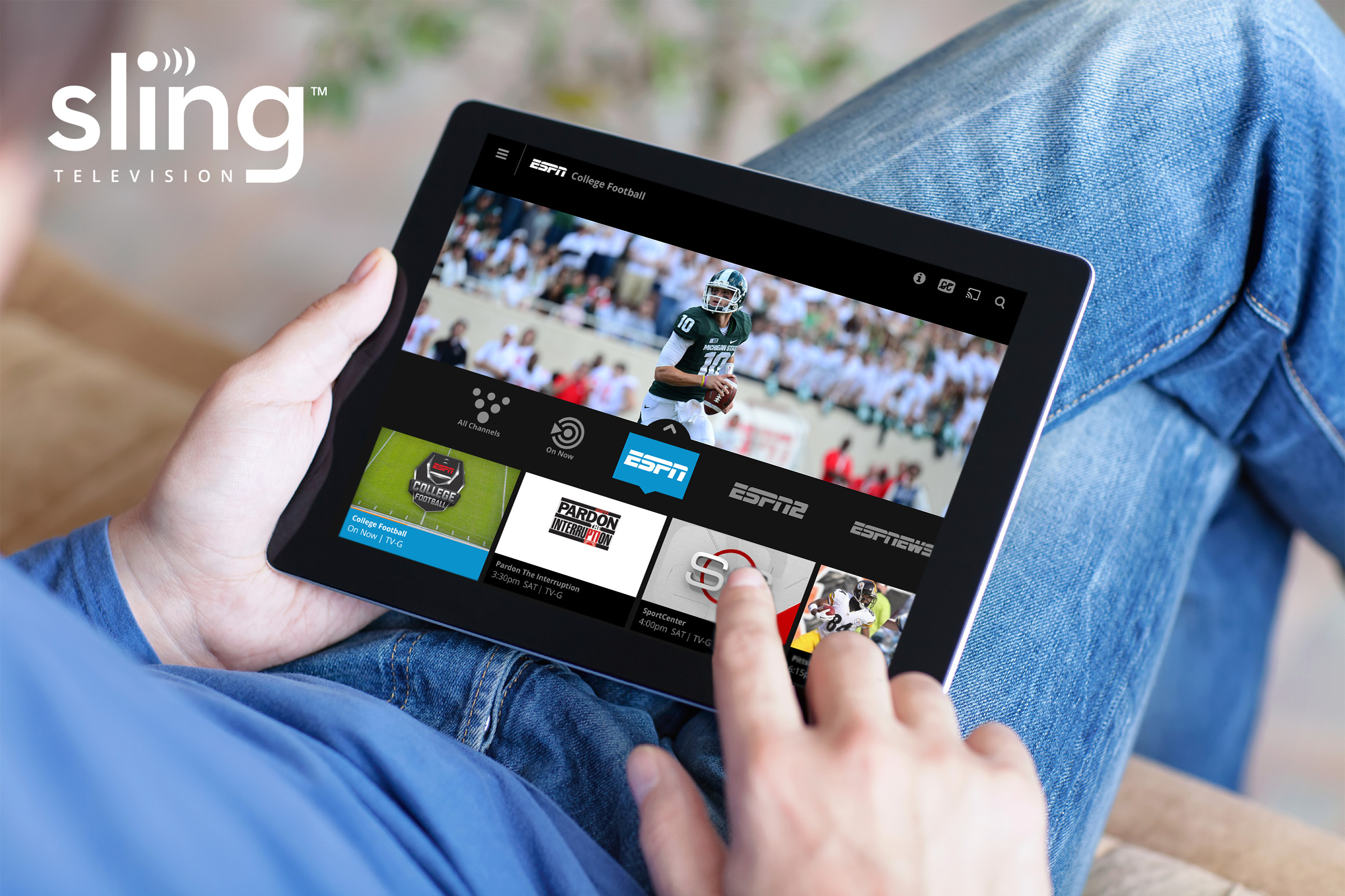 A person using Sling TV on a tablet