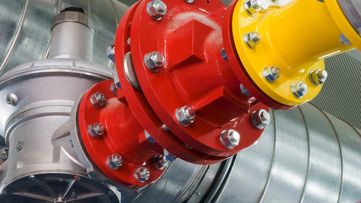 Industrial equipment painted red and yellow.