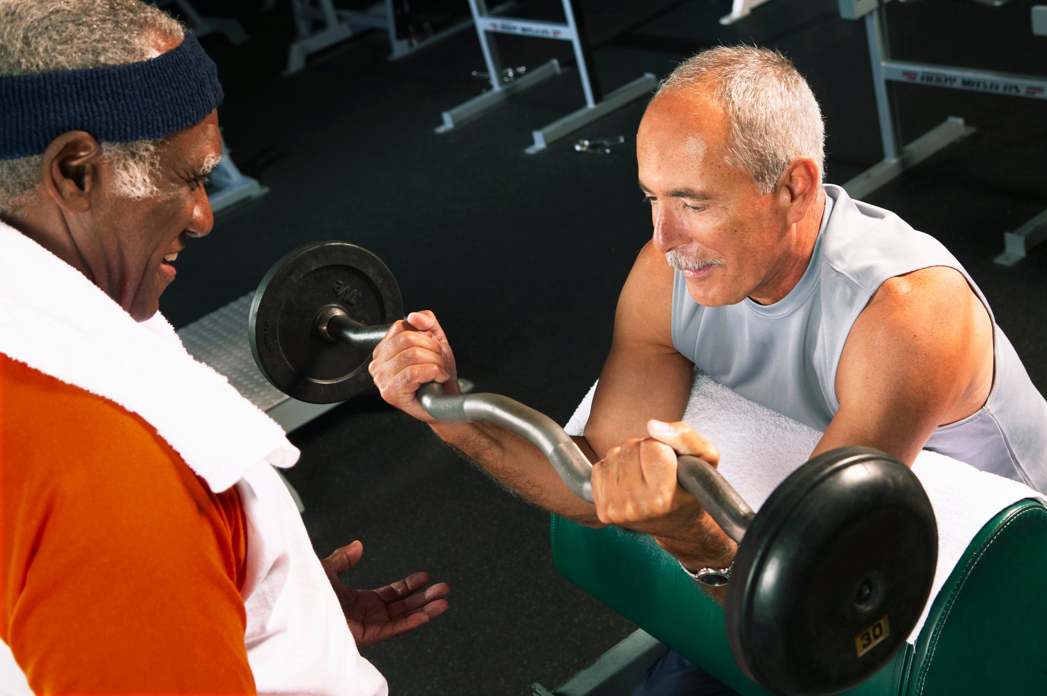 Two men exercising at a gym