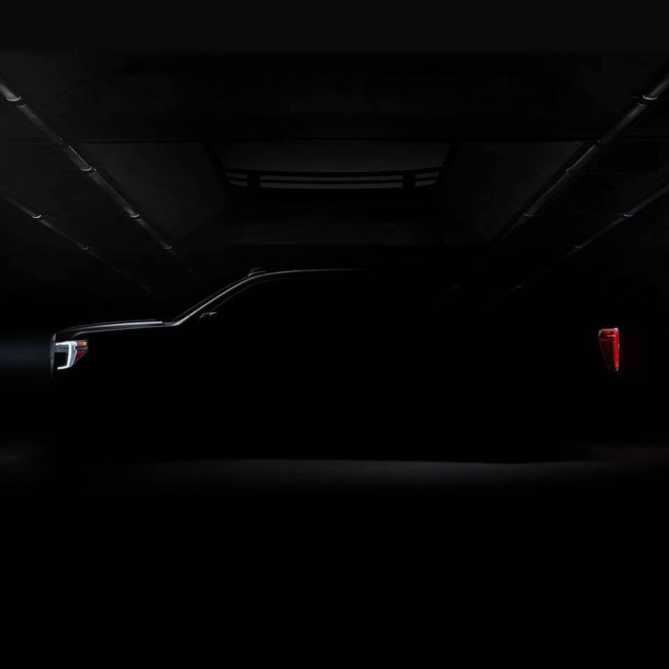 A darkened photo of the side of the 2019 GMC Sierra pickup. Only the truck's general outline is visible.