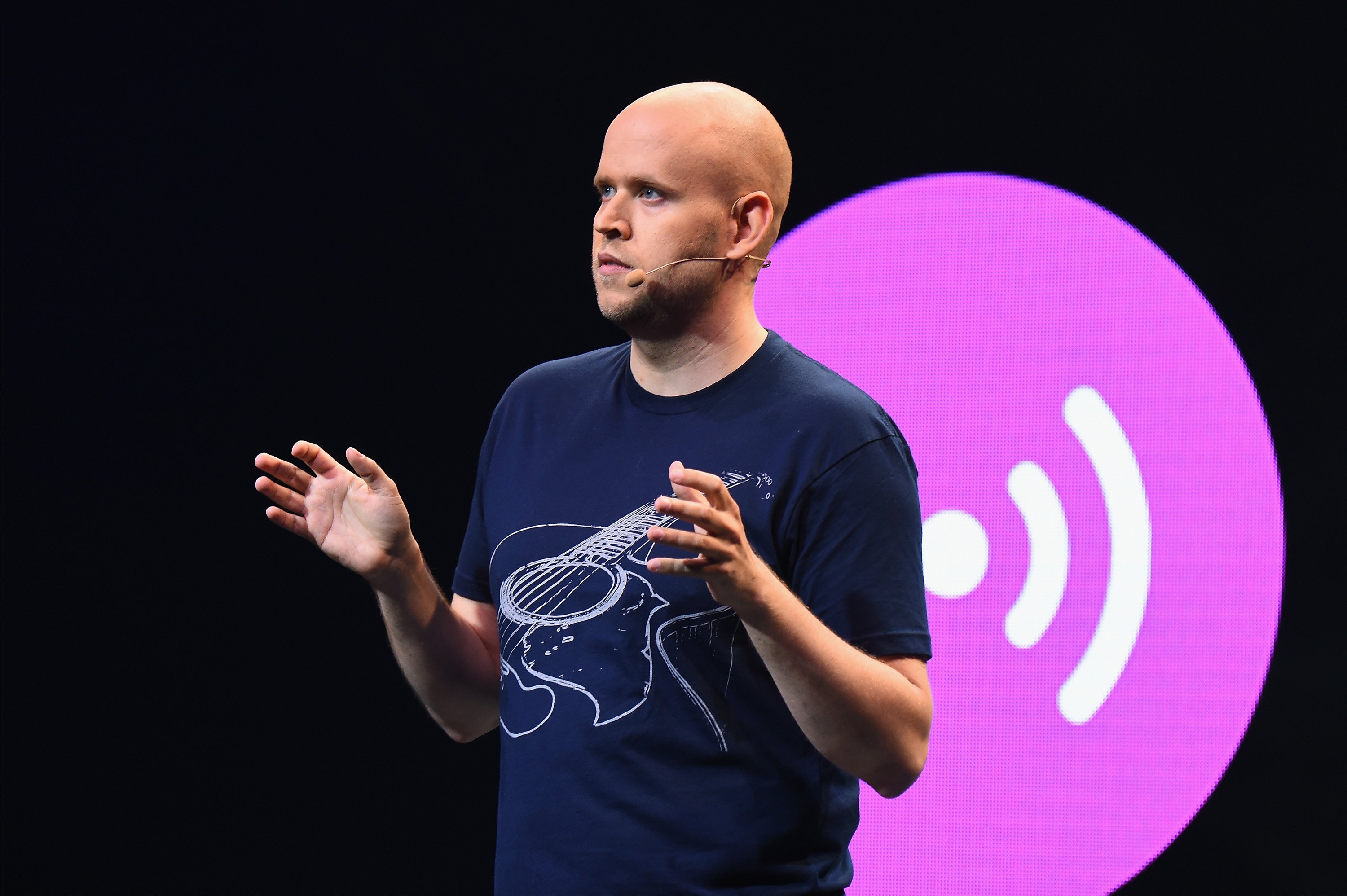 Daniel Ek speaking on stage at a press conference
