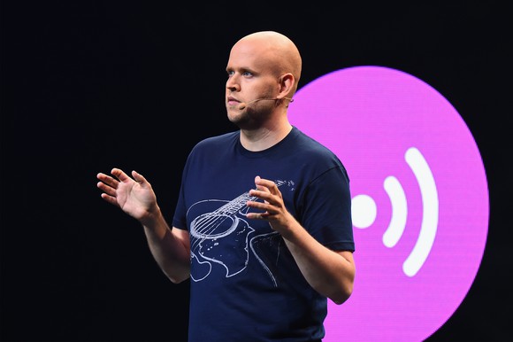 Daniel Ek speaking on stage at a press conference