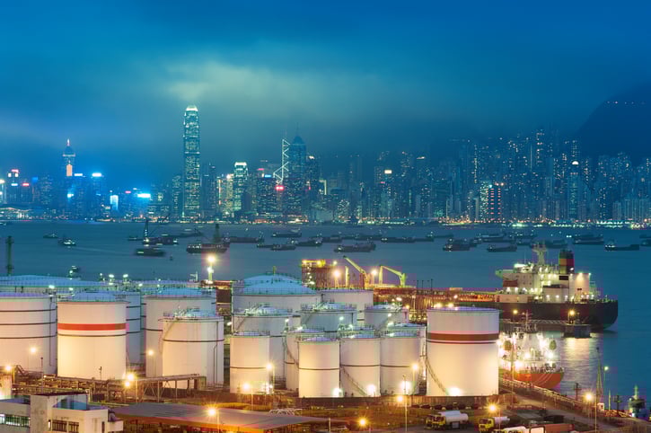 A Chinese city in the background with energy infrastructure in the foreground.