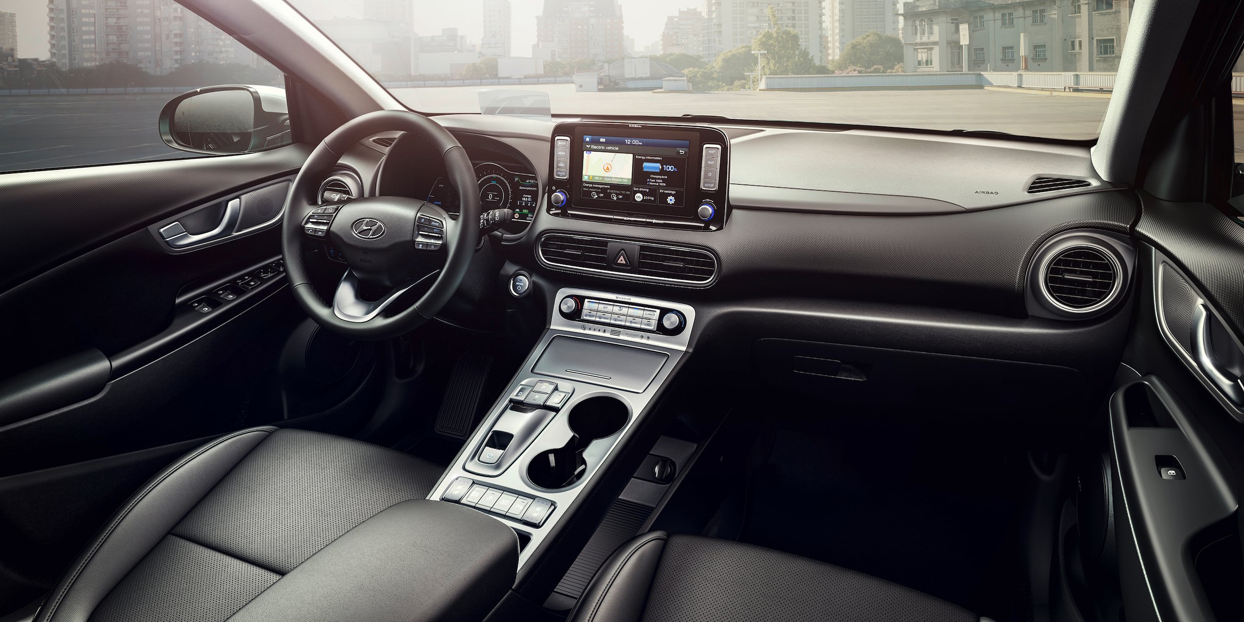 The dashboard and front seats of the Hyundai Kona Electric.