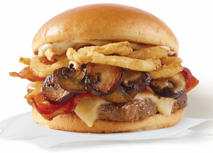 Wendy's "Smoky Mushroom Bacon Cheeseburger" on white background.