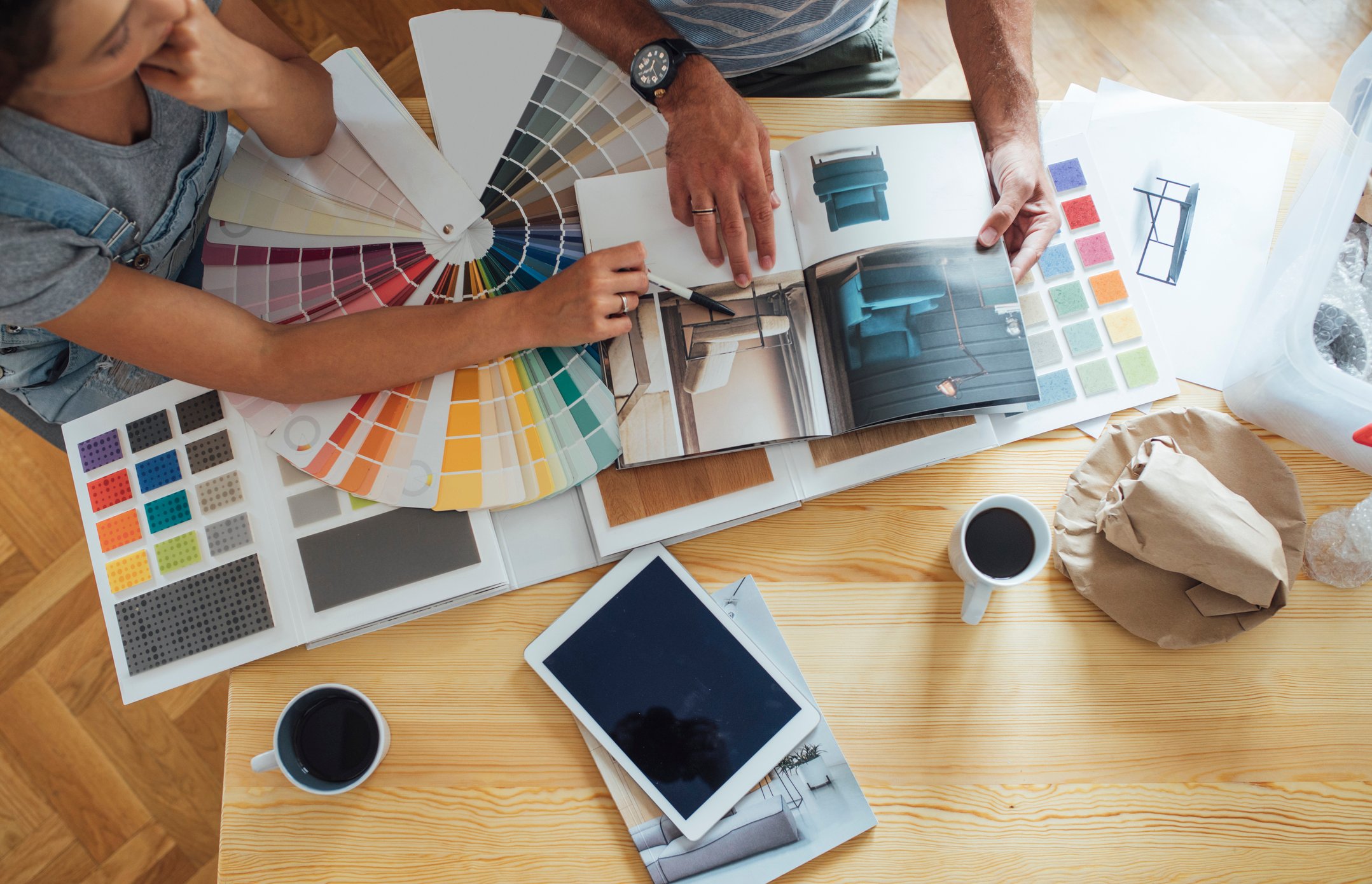 Couple looking at paint samples and other remodeling materials.