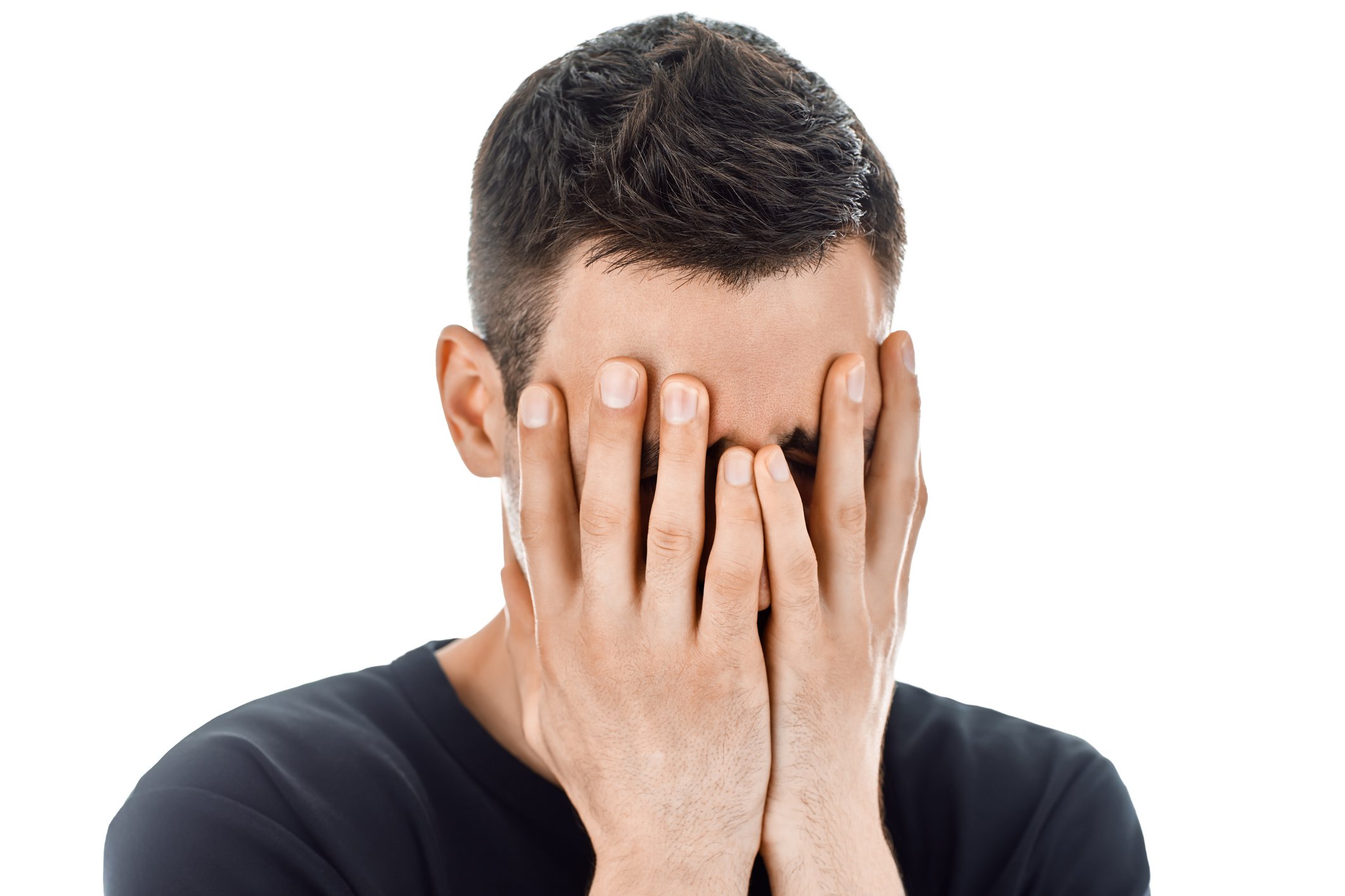 Man covering his face