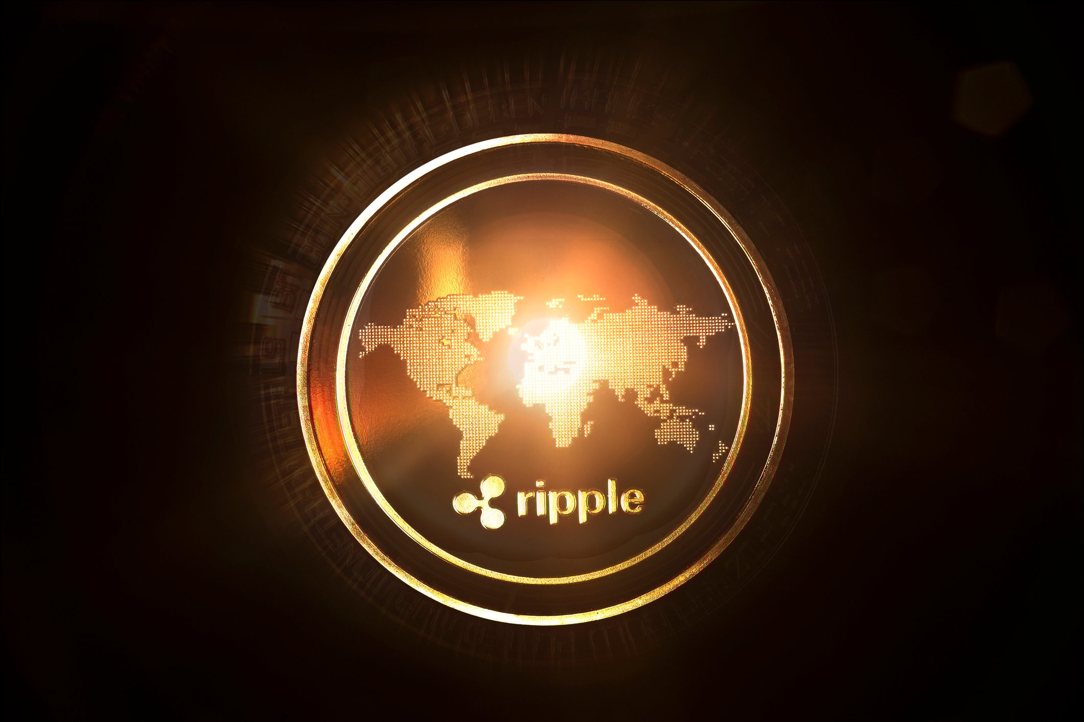 Digital rendering of a gold coin, featuring a world map and the Ripple logo.