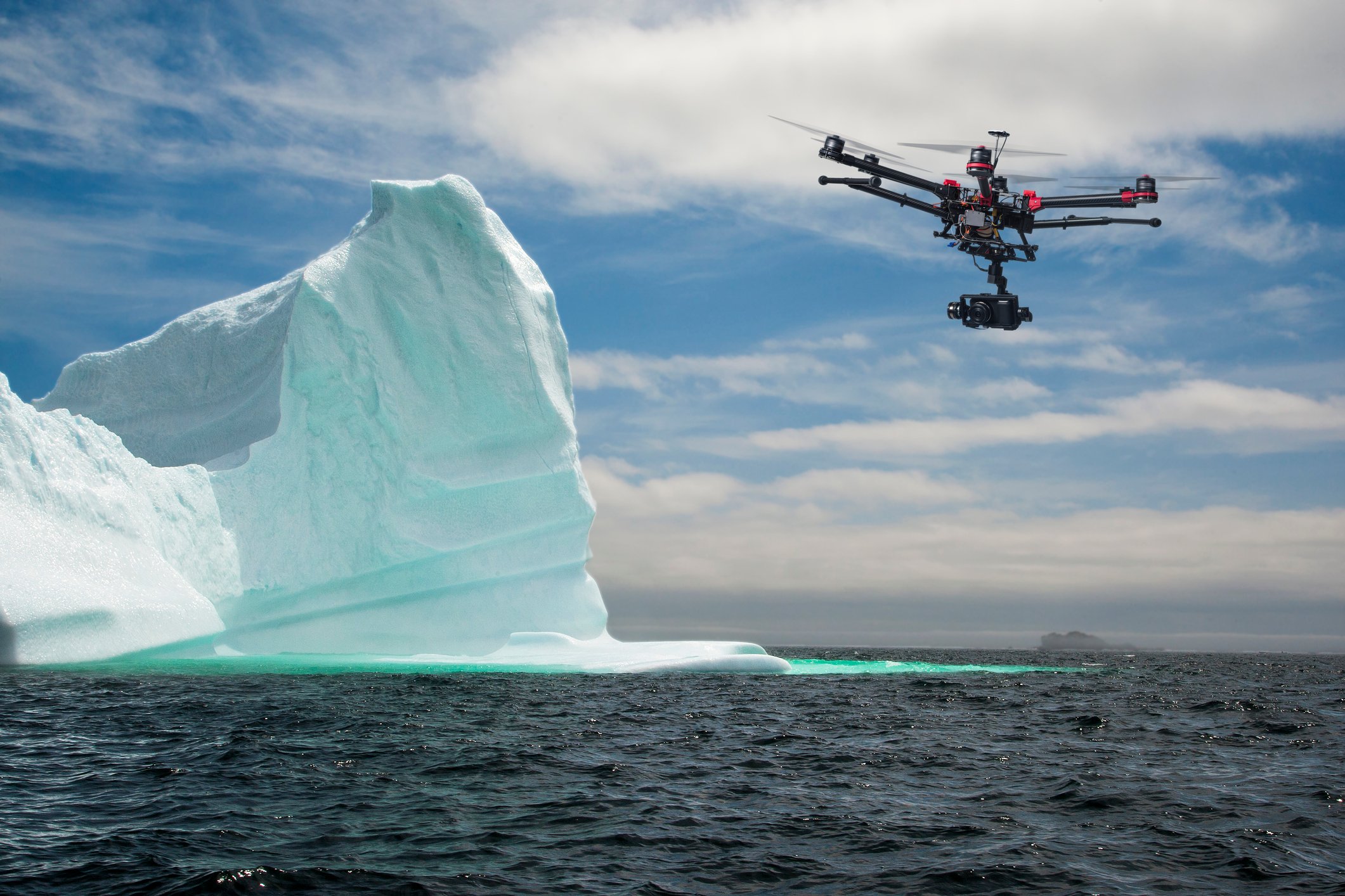 Drone flying near iceberg