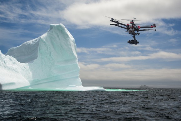 Drone flying near iceberg