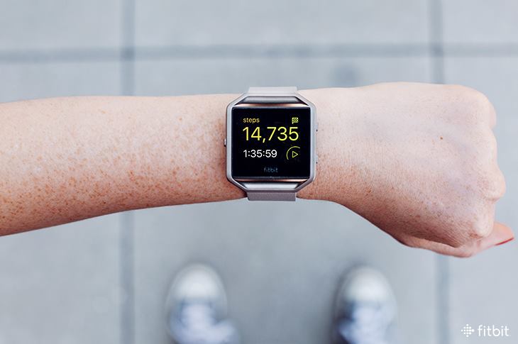 Fitness tracker on a wrist.