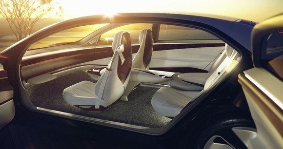 A look into the I.D. Vizzion concept car's interior, showing white seats and a smooth dashboard with no controls.