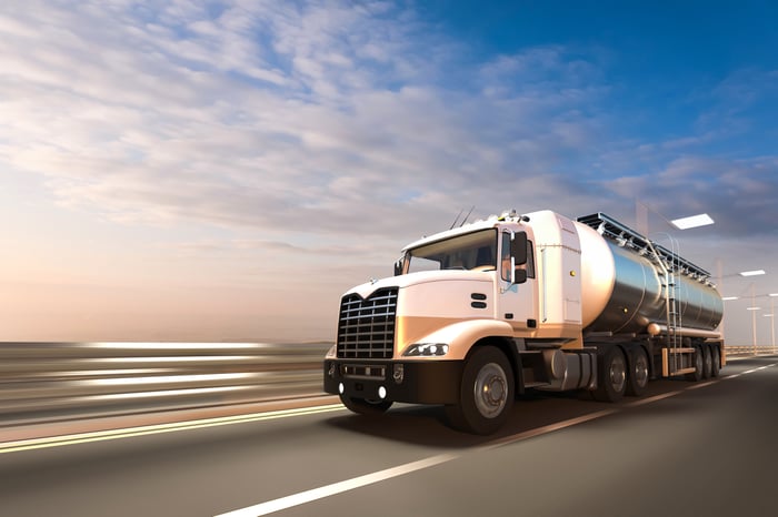 Fuel truck driving down the highway. 