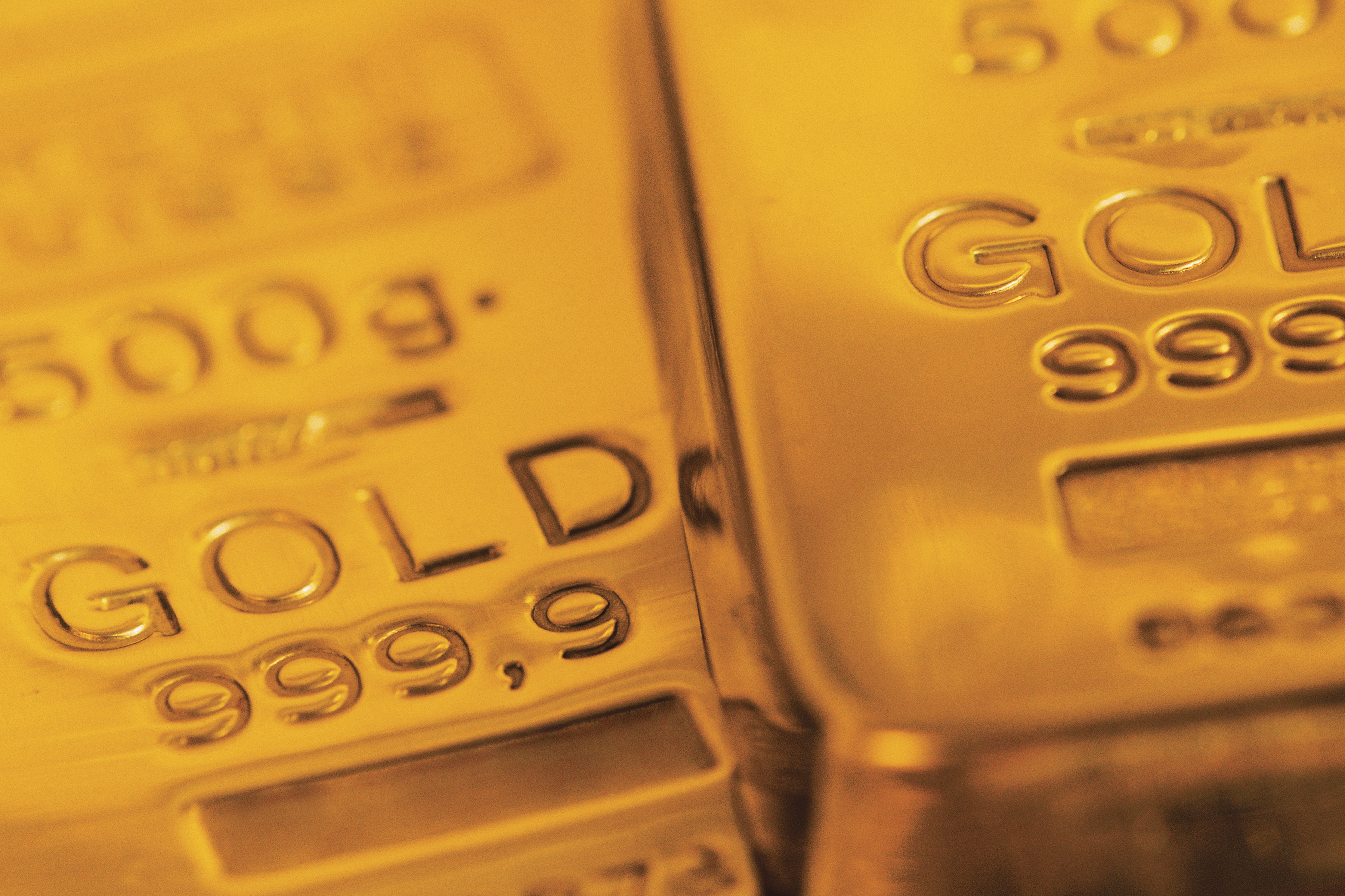 Gold bars lying next to each other.